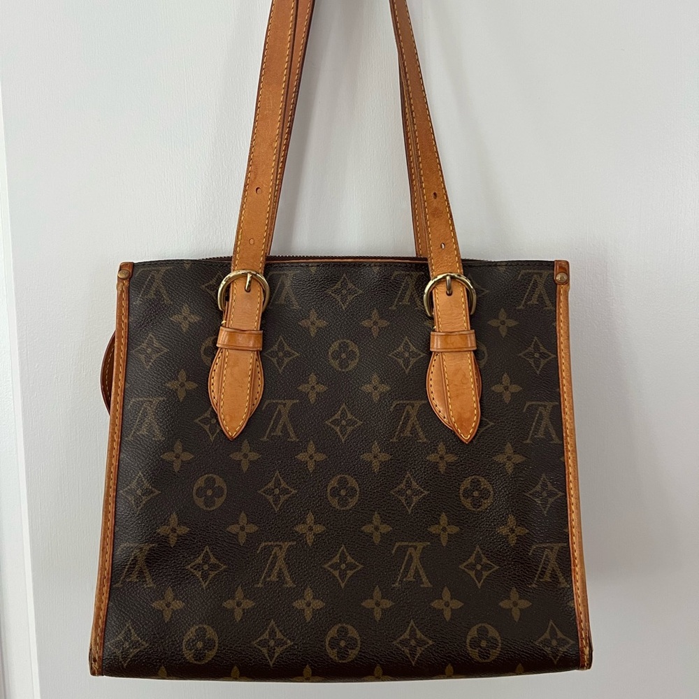 Could be used as a shoulder bag or a small tote bag, selling because NEVER used!